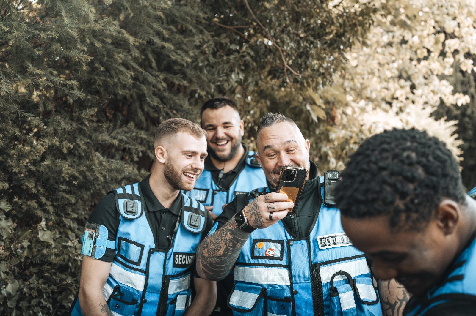 AV Group UK security team sharing a moment on the radio during an event