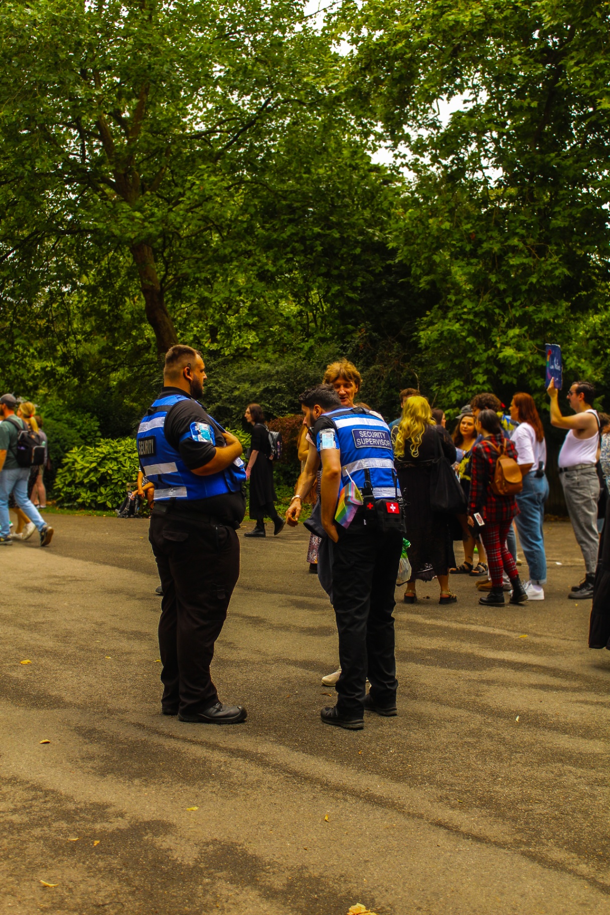 Two SIA-licensed officers managing crowd movement on the Bath Pride parade route
