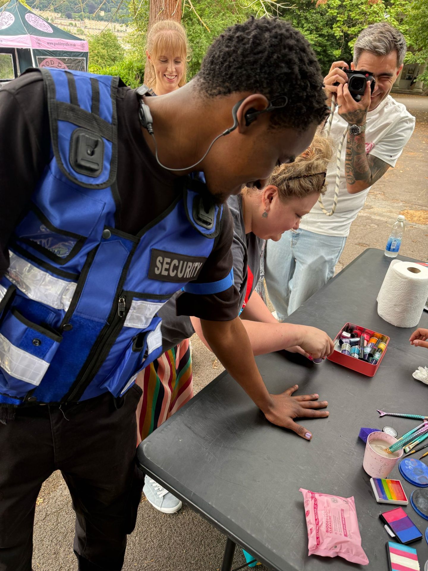 AV Group UK security officer supervising a face-painting stall at Bath Pride