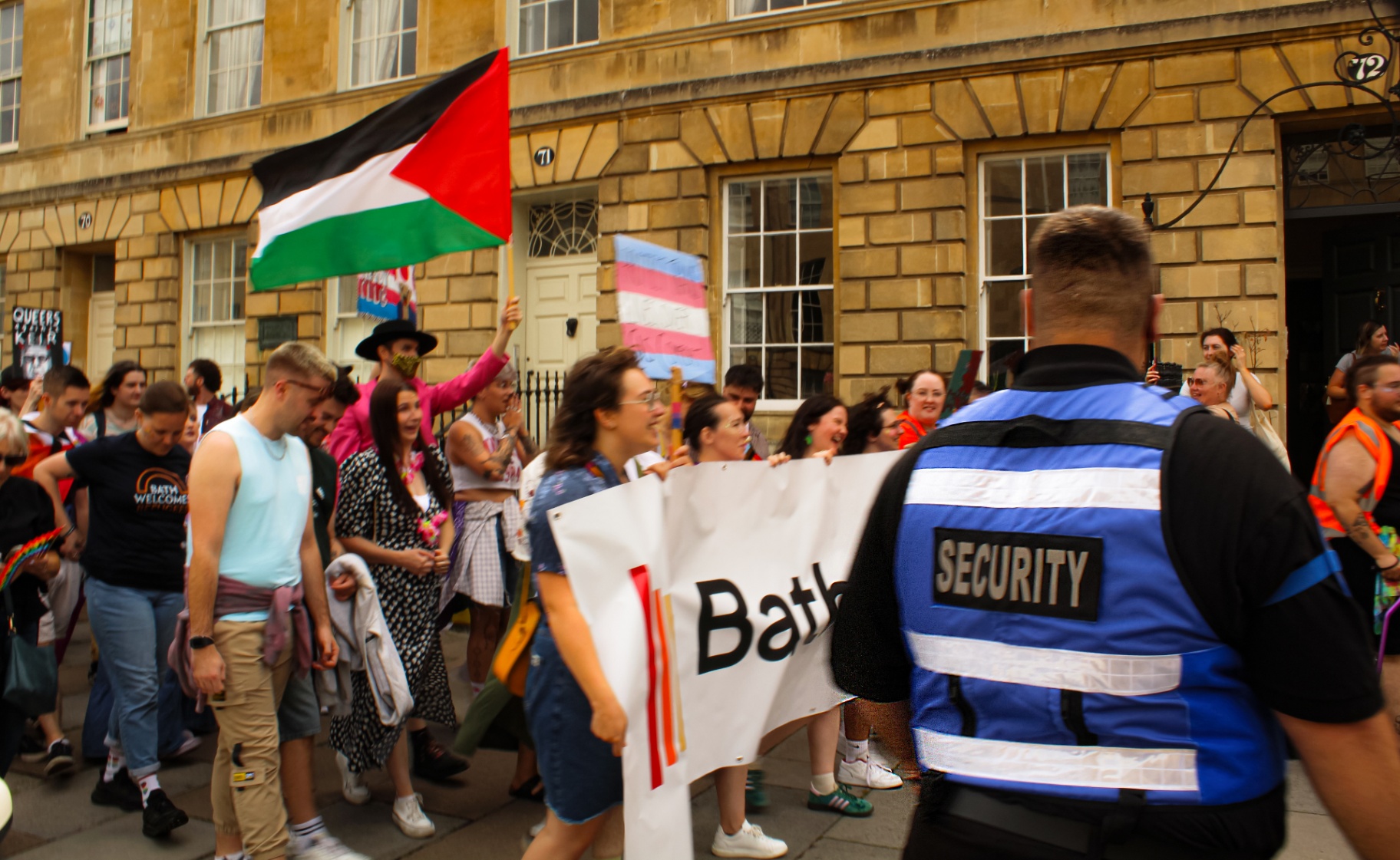 Event security team managing the Bath Pride parade route through the city centre