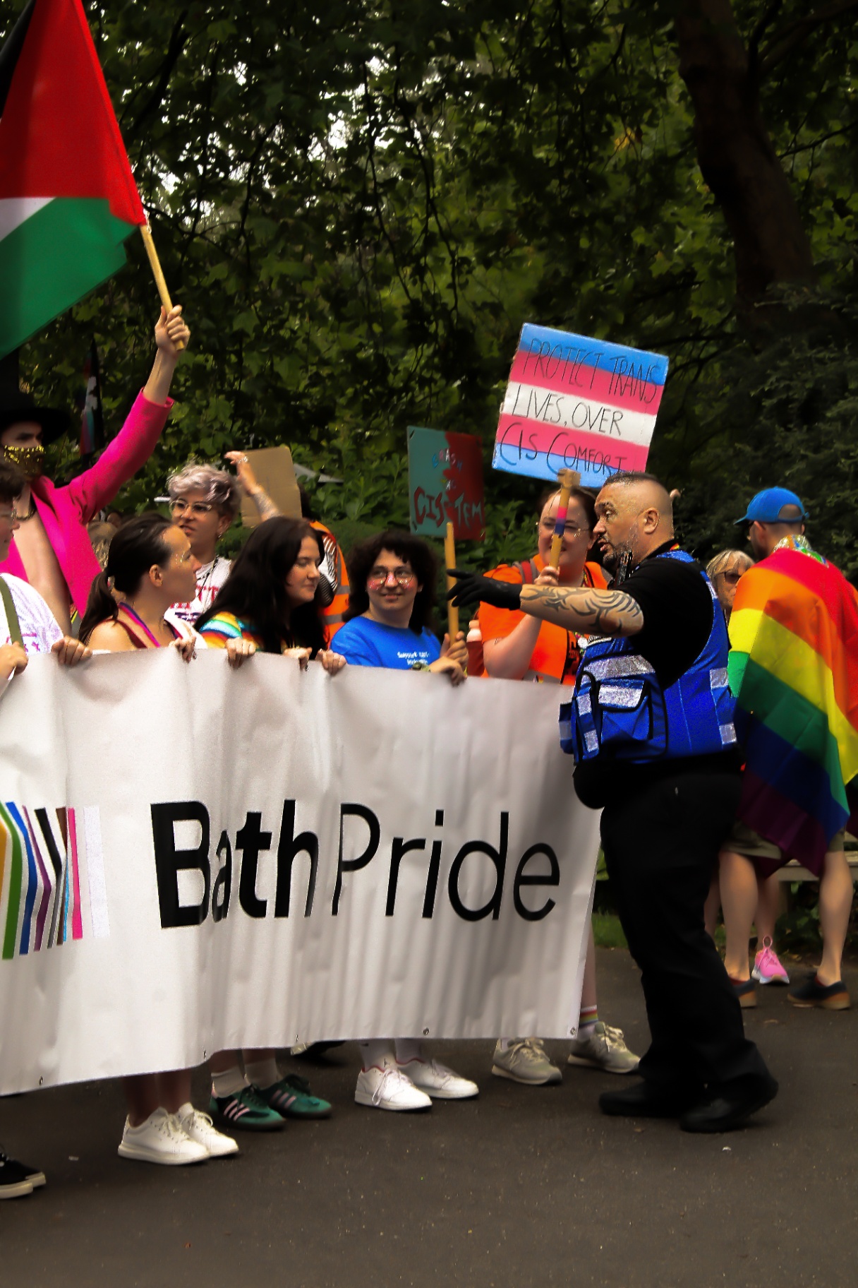 SIA-licensed officers stewarding the Bath Pride parade banner